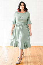 The Maggie Millan- Sage Colored Bell Sleeve Midi Dress